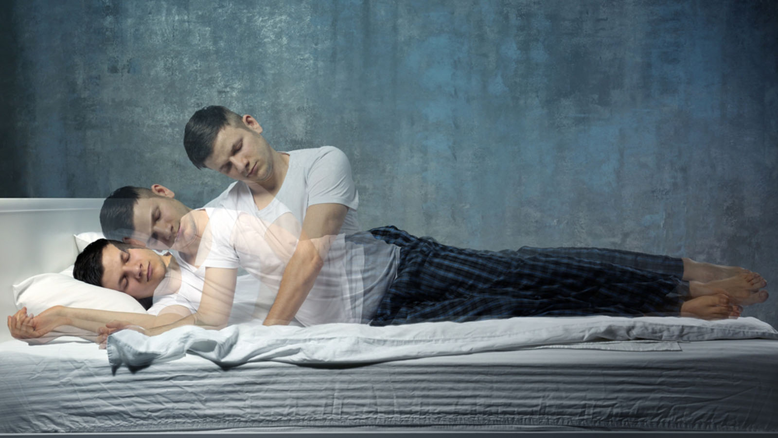 Multiple-exposure photograph of a man appearing to rise out of his own sleeping body